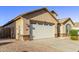 Beautiful home with a brick paved driveway and a pristine two-car garage with a manicured lawn at 2236 W Aston Dr, San Tan Valley, AZ 85144