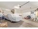 Spacious garage with concrete floor, storage, and covered car at 2236 W Aston Dr, San Tan Valley, AZ 85144
