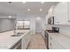 Bright kitchen featuring stainless steel appliances, a large island, and quartz countertops at 2236 W Aston Dr, San Tan Valley, AZ 85144