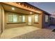 Covered patio with ambient lighting providing a perfect outdoor space for dining and relaxation at 2236 W Aston Dr, San Tan Valley, AZ 85144