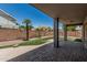 Covered patio overlooks backyard with artificial grass and desert landscaping at 2542 E Los Alamos St, Gilbert, AZ 85295