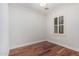 Bright bedroom features hardwood floors and plantation shutters offering natural light at 2542 E Los Alamos St, Gilbert, AZ 85295