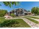 Beautiful front yard featuring rock landscaping, decorative grass, and well-maintained lawn at 2542 E Los Alamos St, Gilbert, AZ 85295