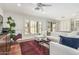 Open living room area with hardwood floors and backyard views through plantation shutters at 2542 E Los Alamos St, Gilbert, AZ 85295