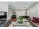 Open concept living room features hardwood floors, stylish furniture, and a piano at 2542 E Los Alamos St, Gilbert, AZ 85295