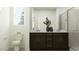 Bathroom with a double sink vanity, modern fixtures, and a sleek glass shower at 3122 S 156Th Ave, Goodyear, AZ 85338