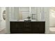 Bathroom vanity with double sinks, dark wood cabinets, and modern fixtures at 3122 S 156Th Ave, Goodyear, AZ 85338
