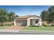 Charming single-story home with a tile roof, desert landscaping, and a two-car garage at 3122 S 156Th Ave, Goodyear, AZ 85338