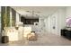 Bright open-concept living room boasts modern lighting and neutral decor, creating a welcoming and stylish space at 3122 S 156Th Ave, Goodyear, AZ 85338