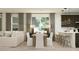 Cozy living space with neutral tones with kitchen, dining and living areas bathed in natural light at 3122 S 156Th Ave, Goodyear, AZ 85338