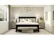 Main bedroom with modern decor, stylish lighting, and neutral color palette at 3122 S 156Th Ave, Goodyear, AZ 85338