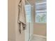Neutral bathroom featuring glass enclosed shower and large towel at 3123 S 155Th Ln, Goodyear, AZ 85338