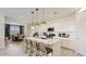 Open-concept kitchen with large island, pendant lighting, and stainless steel appliances at 3123 S 155Th Ln, Goodyear, AZ 85338