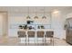 Modern kitchen featuring an island with barstool seating and stainless steel appliances at 3123 S 155Th Ln, Goodyear, AZ 85338
