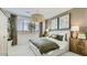 Cozy bedroom featuring an olive green bedspread, neutral walls and decorative accents at 3123 S 155Th Ln, Goodyear, AZ 85338