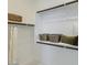 Bright walk-in closet featuring shelving and storage baskets at 3123 S 155Th Ln, Goodyear, AZ 85338