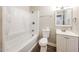 This renovated bathroom has a tub, shower, modern vanity and neutral paint at 3238 W Rose Ln, Phoenix, AZ 85017