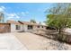 A bright single-story home with a long driveway and mature trees, offering a welcoming curb appeal at 3238 W Rose Ln, Phoenix, AZ 85017