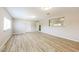Bright living room with sleek light wood flooring and multiple windows for natural light at 3238 W Rose Ln, Phoenix, AZ 85017