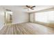 Inviting living room featuring light wood flooring, a ceiling fan, and neutral-toned walls at 3238 W Rose Ln, Phoenix, AZ 85017