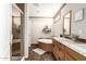 Bright bathroom featuring a shower, soaking tub and dual sinks at 32650 N 223Rd Dr, Wittmann, AZ 85361