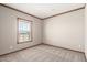 Neutral bedroom with carpet and a window allowing natural light to brighten the room at 32650 N 223Rd Dr, Wittmann, AZ 85361