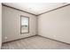 Neutral bedroom with carpet and a window allowing natural light to brighten the room at 32650 N 223Rd Dr, Wittmann, AZ 85361