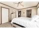 Inviting bedroom featuring neutral decor, a ceiling fan and a chest of drawers for storage at 32650 N 223Rd Dr, Wittmann, AZ 85361