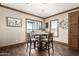 Cozy dining area featuring a stylish table setting near a sliding glass door at 32650 N 223Rd Dr, Wittmann, AZ 85361