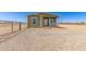Inviting home featuring a well-maintained exterior and charming front porch at 32650 N 223Rd Dr, Wittmann, AZ 85361