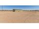 Home exterior showing the green exterior and expansive backyard at 32650 N 223Rd Dr, Wittmann, AZ 85361