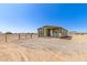 Inviting home featuring a well-maintained exterior with a cozy front porch and ample natural light at 32650 N 223Rd Dr, Wittmann, AZ 85361