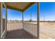 Enjoy the scenic views from this home's comfortable and spacious front porch at 32650 N 223Rd Dr, Wittmann, AZ 85361