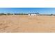 Single-story home with fenced yard and clear sunny skies at 32712 N 223Rd Dr, Wittmann, AZ 85361