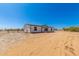 Well-maintained single-story home, featuring a fenced yard, with ample space at 32712 N 223Rd Dr, Wittmann, AZ 85361