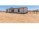 Well-maintained single-story home, featuring a fenced yard, with ample space at 32712 N 223Rd Dr, Wittmann, AZ 85361