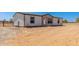 Well-maintained single-story home, featuring a fenced yard, with ample space at 32712 N 223Rd Dr, Wittmann, AZ 85361
