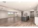 Spacious living area boasting natural light, wood-look floors, and an open layout perfect for entertaining at 32712 N 223Rd Dr, Wittmann, AZ 85361