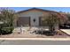 Charming home exterior with lush landscaping and decorative yard art at 3330 E Main St # 448, Mesa, AZ 85213