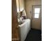 Laundry room with wood-look floors and a white washing machine at 3330 E Main St # 448, Mesa, AZ 85213