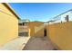 Exterior view of backyard and shed, enclosed by concrete block walls at 42 S Vineyard --, Mesa, AZ 85210