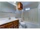 Bathroom features a vanity, wood cabinet, toilet and a shower over tub at 42 S Vineyard --, Mesa, AZ 85210