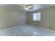 Bright bedroom with marble-look tile flooring and a modern ceiling fan at 42 S Vineyard --, Mesa, AZ 85210