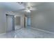 Bedroom featuring tile flooring, closet with mirror doors, and neutral color walls at 42 S Vineyard --, Mesa, AZ 85210