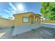 A single-story house featuring a covered porch and desert landscaping at 42 S Vineyard --, Mesa, AZ 85210