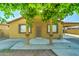 Charming single-story home with a covered porch and mature trees at 42 S Vineyard --, Mesa, AZ 85210