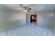 Large open-concept living room with tile floors, flowing into the kitchen at 42 S Vineyard --, Mesa, AZ 85210