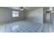 Bright, airy living room featuring tile flooring and a ceiling fan at 42 S Vineyard --, Mesa, AZ 85210