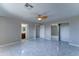 Bright Primary bedroom featuring stylish tile flooring, a ceiling fan, and a closet with mirrored doors at 42 S Vineyard --, Mesa, AZ 85210