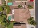 Aerial view of the property showcasing backyard pool, covered patio, and mature trees at 5060 S Clancy --, Mesa, AZ 85212